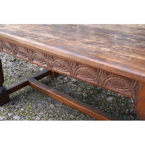 361 - 19thC Jacobian style Refectory table with plank top above carved frieze and 4 turned legs and straig... 