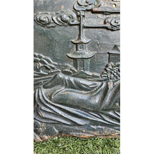 369 - Large Cast Iron black painted panel with semi nude and Pagoda decoration 111cm in Length