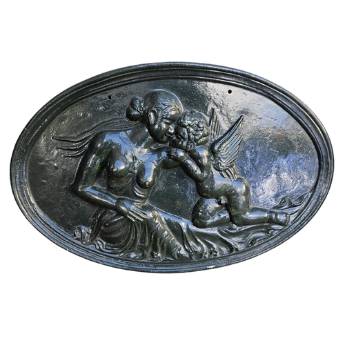 372 - Oval Cast Iron Painted roundel with Nude and Cherub decoration 72cm in Width