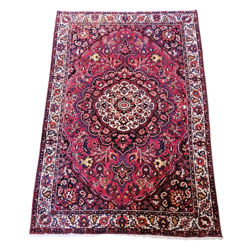 379 - Large Bakhtier Rug of central medallion and floral border. 323 x 217cm