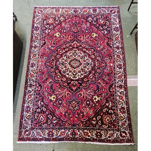 379 - Large Bakhtier Rug of central medallion and floral border. 323 x 217cm