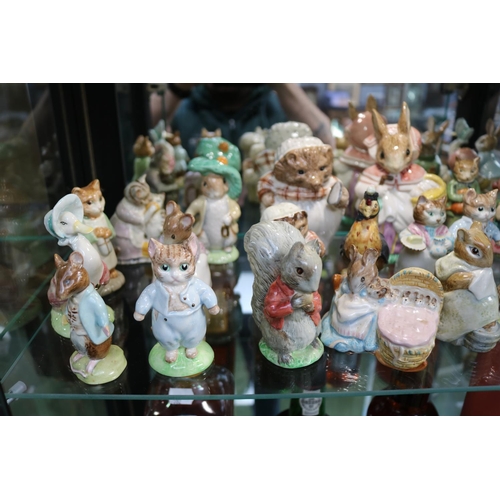 104 - Large Collection of Beswick and Royal Albert Beatrix Potter figures (24)