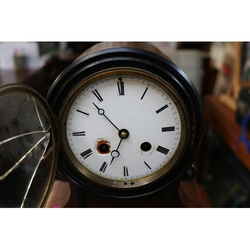 116 - Victorian enamel faced Roman pillar mantel clock with scroll supports. 27cm in Height