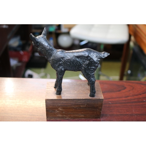 143 - Cast Iron painted model of a Lamb on wooden base