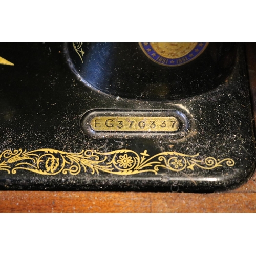 212 - Cased Singer Sewing machine No.99