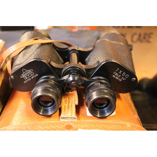 215 - Pair of Cased Seeker 7 x 50 Binoculars in Leather case, Boxed Optus Zoom 20-60x60 and a Cobra Tripod