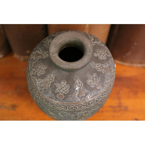 24 - Islamic Style Bronze Calligraphic Vase with Silver Overlay An undated archaistic hollow-cast Baluste... 