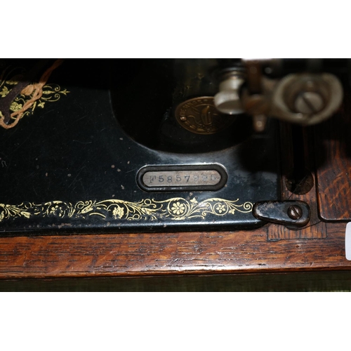 243 - Oak Cased Singer sewing machine