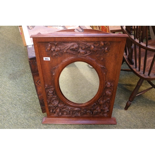 285 - Oak Carved floral decorated mirror with oval inset