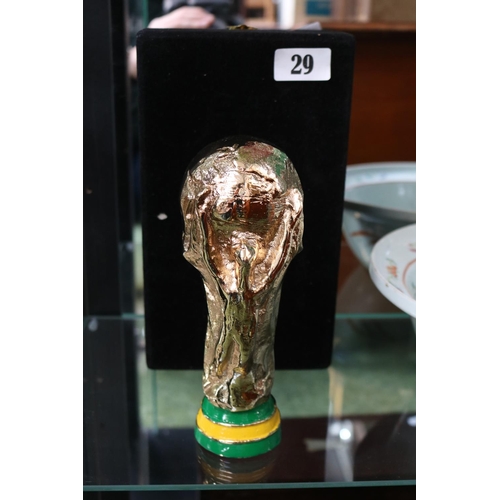 29 - 2002 FIFA WORLD CUP FIVE-TIMES WINNER TROPHY
A miniature trophy in the image of the original FIFA Wo... 