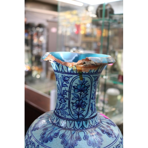 32D - Large Chinese Lidded Ginger Jar with floral decoration and a Persian blue floral decorated vase. 45c... 