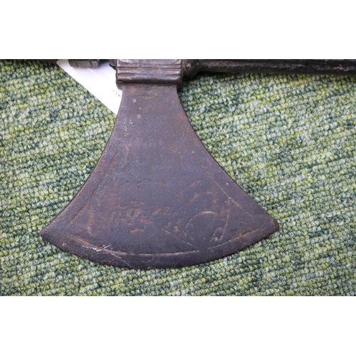 54 - Medieval Ottoman style cast iron war axe with eastern script and figural motif to axe head. 55cm in ... 