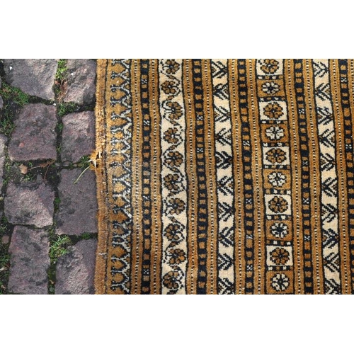 399 - Very Large Indian design Brown ground rug with tassel ends