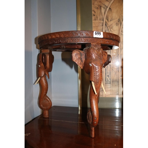 699 - Indonesian Hardwood circular table with Elephant head supports