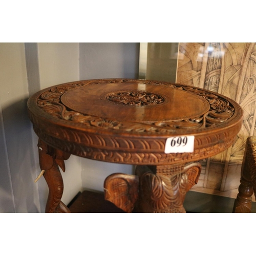 699 - Indonesian Hardwood circular table with Elephant head supports