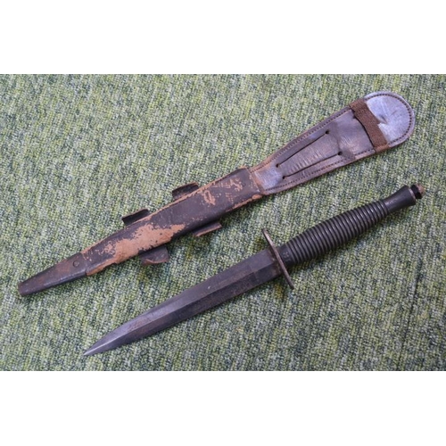 119 - Fairbairn–Sykes double-edged fighting knife in frog. 28.5cm in Length