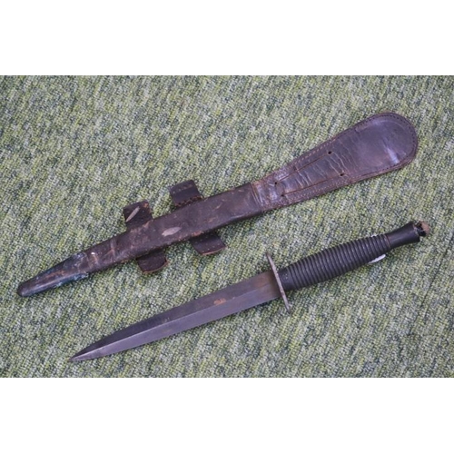 120 - Fairbairn–Sykes double-edged fighting knife in frog. 28.5cm in Length