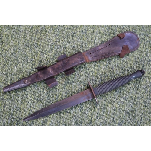 121 - Fairbairn–Sykes double-edged fighting knife in frog. 28.5cm in Length