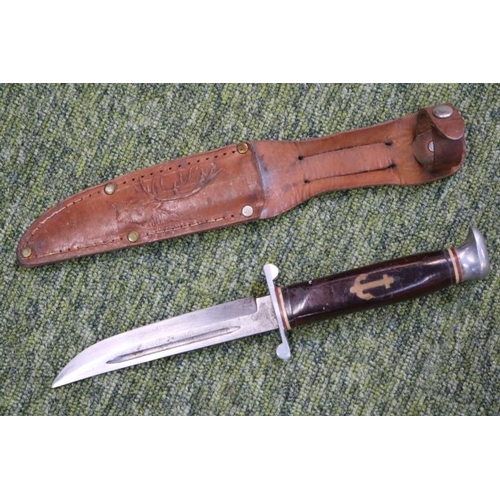 122 - William Rodgers style hunting knife in embossed leather scabbard. 24cm in Length