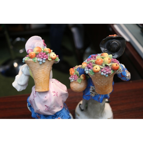 409 - Pair of 19thC Sitzendorf Fruit Seller figures with blue mark to base. 23cm in Height