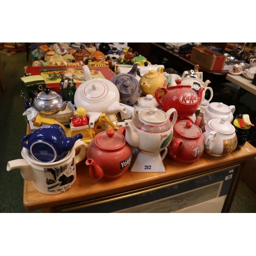 212 - Large collection of Novelty Teapots to include Marmite, Kit Kat, Ransomes Lawnmowers, JCB, Black and... 