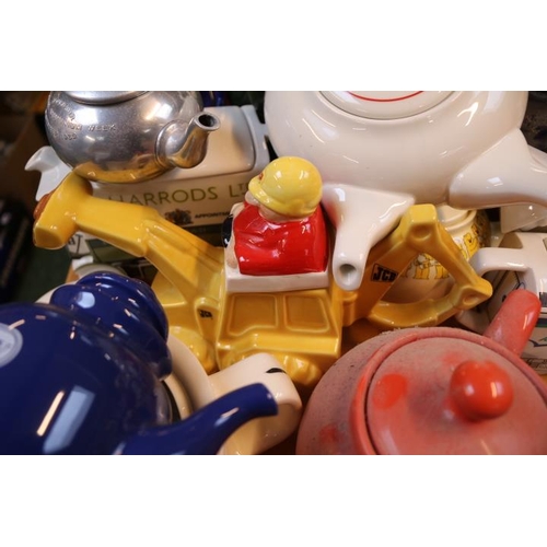 212 - Large collection of Novelty Teapots to include Marmite, Kit Kat, Ransomes Lawnmowers, JCB, Black and... 