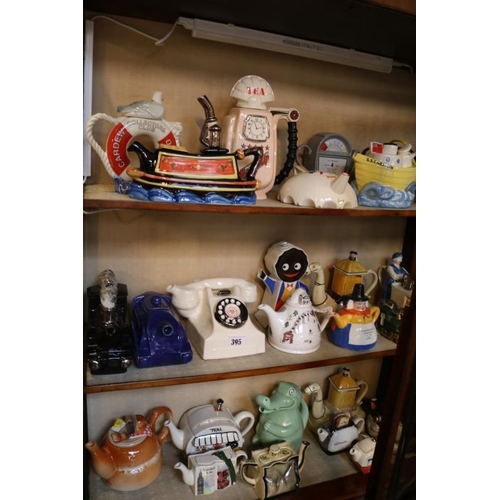 395 - Good collection of Novelty Teapots to include Tony Carter, Wade, Carlton ware etc.