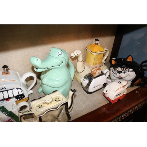 395 - Good collection of Novelty Teapots to include Tony Carter, Wade, Carlton ware etc.