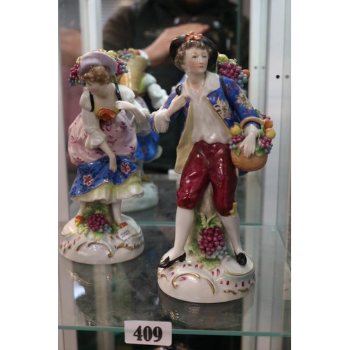 409 - Pair of 19thC Sitzendorf Fruit Seller figures with blue mark to base. 23cm in Height