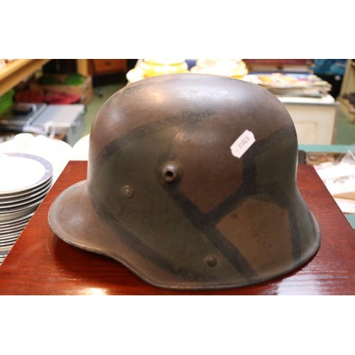 447C - WW1 German Transitional M17 Helmet with Camouflage painting, battle damage and liner.