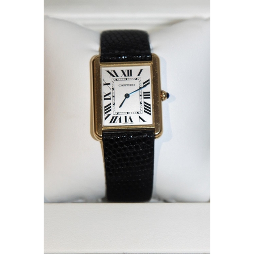 519i - Cartier - A Swiss 18ct gold and stainless steel 'Tank Solo' wristwatch. Circa 2006 the signed silver... 