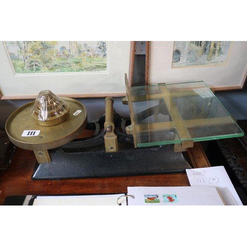 111 - Good quality Cast Iron and Brass grocers scales with glass balance and a set of 6 Brass Graduated we... 