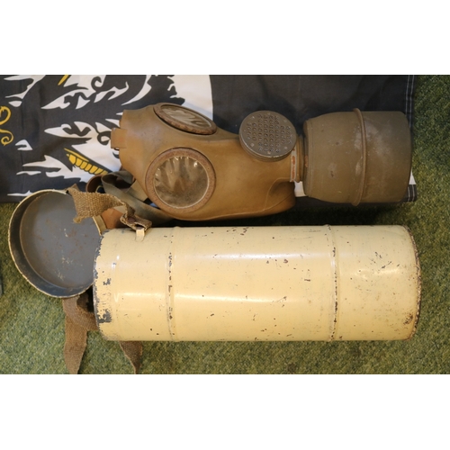 99h - WW2 French gas mask, WW2 British gas mask, German Flag, Militray torch and a trench art shell ashtra... 