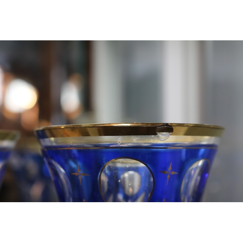 146 - Pair of 19thC Panelled Bohemian Overlay clear and blue glass beakers 12.5cm