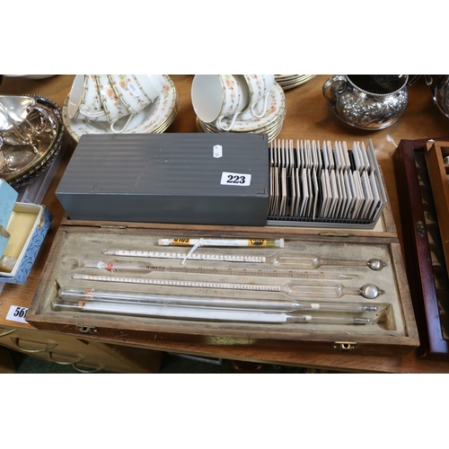 223 - Collection of cased Hydrometers and a collection of Social History Slides