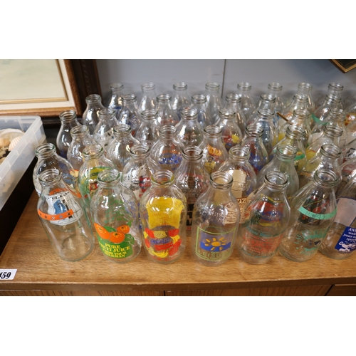 124 - Large collection of Advertising glass Milk Bottles to include Kelloggs, Cadburys, Crusha etc.