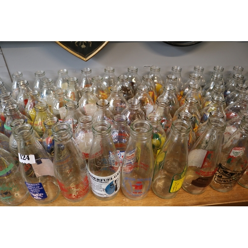 124 - Large collection of Advertising glass Milk Bottles to include Kelloggs, Cadburys, Crusha etc.