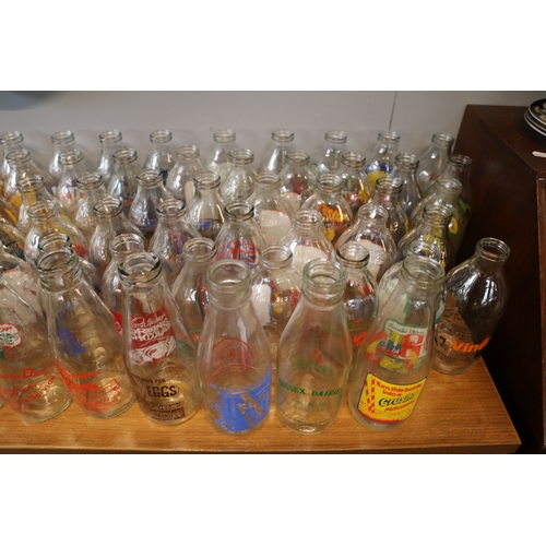 124 - Large collection of Advertising glass Milk Bottles to include Kelloggs, Cadburys, Crusha etc.