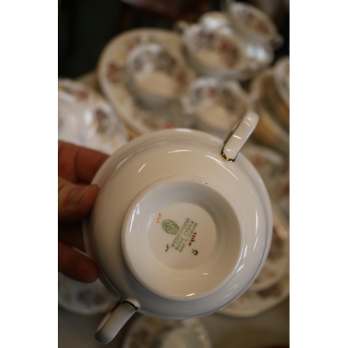 155 - Wedgwood Lichfield dinner service of floral design with gilt banding