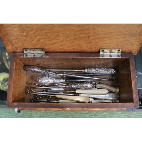 Collection of Silver handled Button hooks and in a Oak Sarcophagus ...