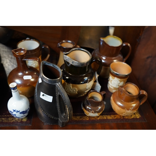 202 - Collection of assorted Two Tone Harvest Jugs and a Doulton Lambeth Blackjack Jug etc.