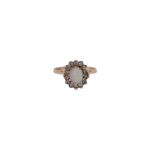 487 - Good quality Ladies 18ct Gold Oval Opal and Diamond cluster ring. Size M. 2.1g total weight