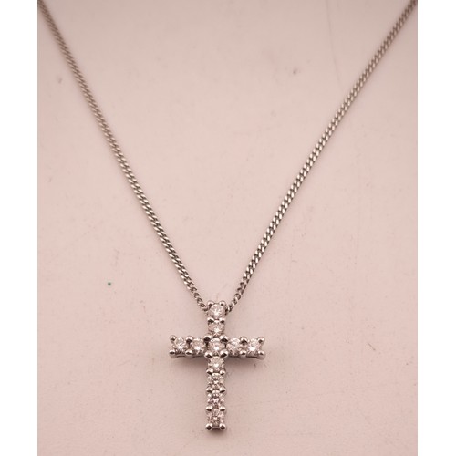 523 - Ladies 9ct Gold Diamond Set cross on 9ct gold chain 0.25ct. 44cm in Length. 2.1g total weight