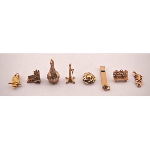 581 - Collection of assorted 9ct Gold Charms to include Whistle, Owl, Church etc. 16.4g total weight