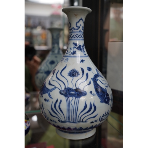 16 - Chinese Blue & White Baluster vase decorated with Koi and Flora.