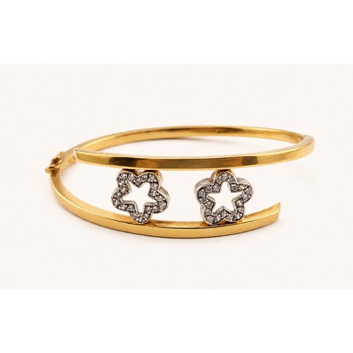 Fine Ladies 18ct Gold crossover Bangle with 2 Star inset Diamond shaped Stars, 64mm in Diameter. 16.2g total weight