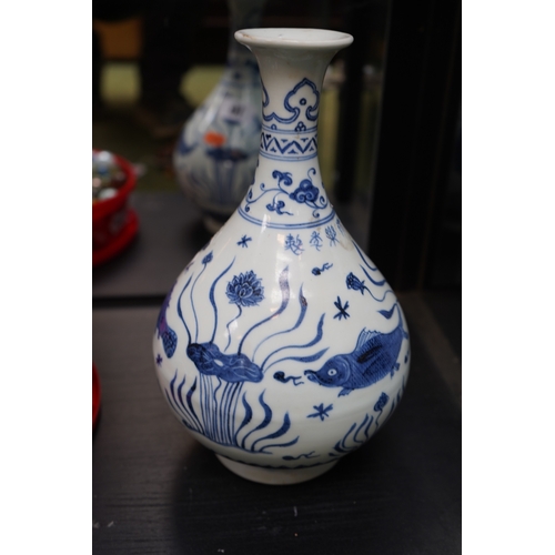 16 - Chinese Blue & White Baluster vase decorated with Koi and Flora.