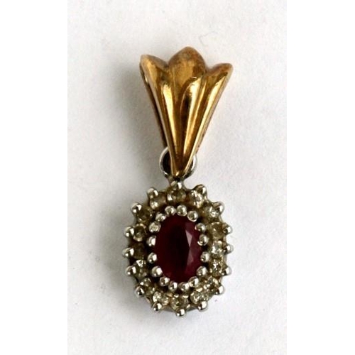 102 - A 9ct gold ruby and diamond pendant