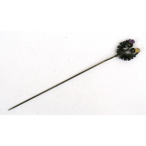 105 - An Edwardian silver twin thistle hat pin.