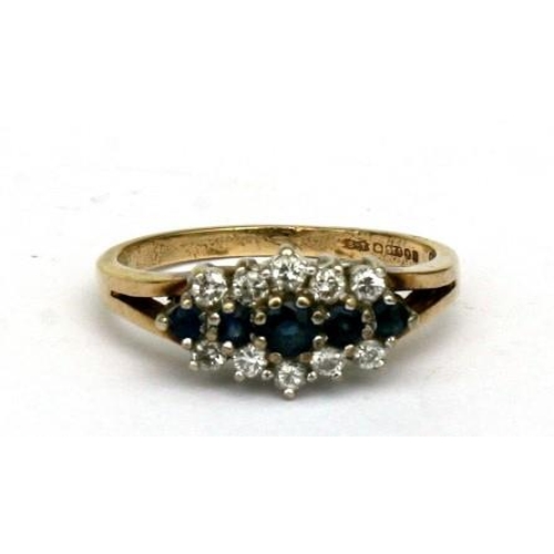 106 - A 9ct gold sapphire and white stone ring. Approx UK size L